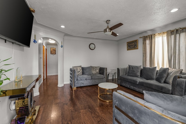 7044 Continental Ave, Warren, MI 48091 - living room featuring a ceiling fan, arched walkways, a textured ceiling, wood finished floors, and recessed lighting