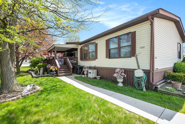 20616 Harmony, Clinton Township, MI 48036 - manufactured / mobile home featuring a front lawn and a porch