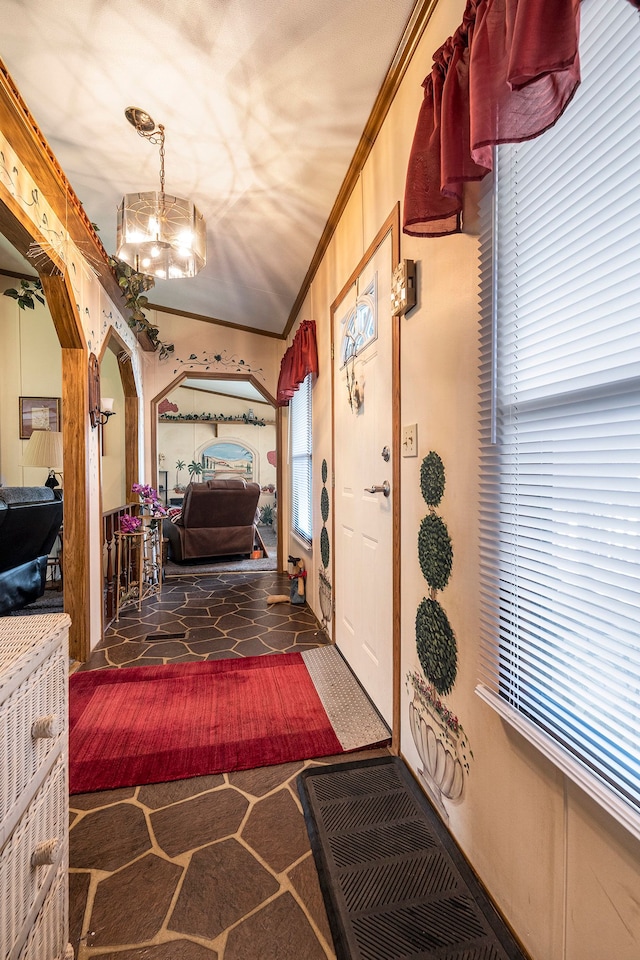 20616 Harmony, Clinton Township, MI 48036 - entrance foyer featuring crown molding, a chandelier, and arched walkways