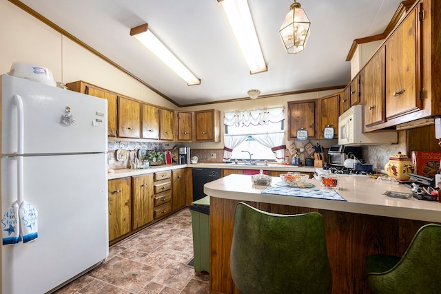 20616 Harmony, Clinton Township, MI 48036 - kitchen with freestanding refrigerator, dishwasher, lofted ceiling, brown cabinets, and a peninsula