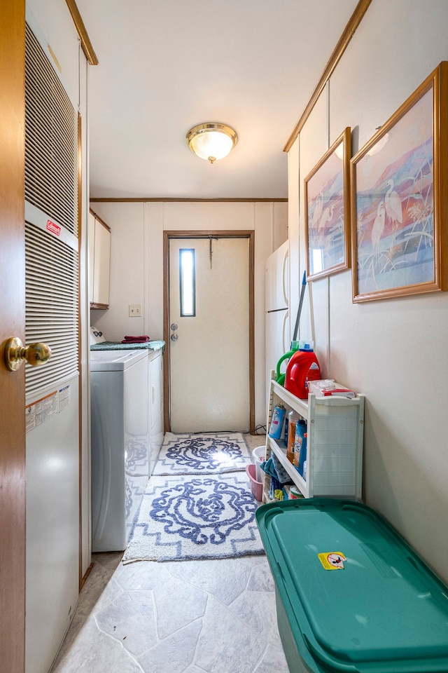 20616 Harmony, Clinton Township, MI 48036 - laundry area with cabinet space, washer and clothes dryer, and a heating unit