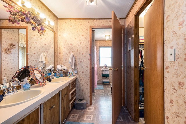 20616 Harmony, Clinton Township, MI 48036 - bathroom featuring wallpapered walls, crown molding, and double vanity
