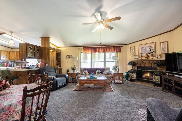 20616 Harmony, Clinton Township, MI 48036 - living room with lofted ceiling, carpet floors, a ceiling fan, a stone fireplace, and ornamental molding