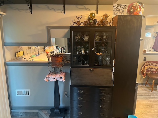bar area with wood finished floors