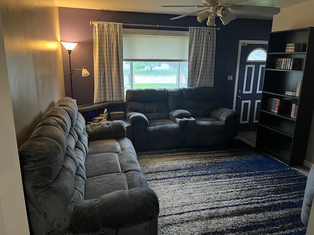 living area featuring a ceiling fan