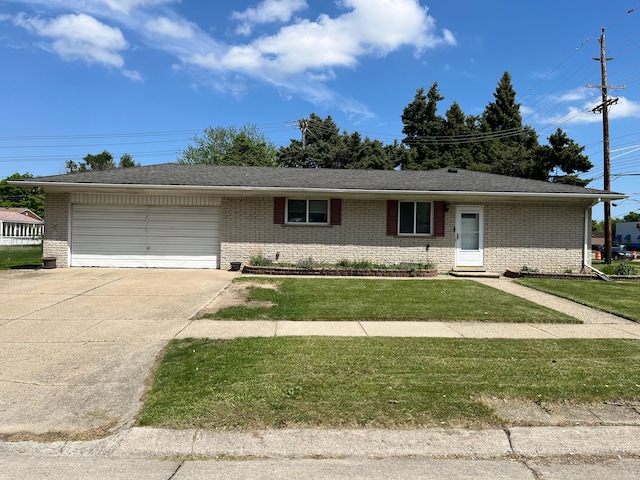 single story home with brick siding, a garage, and driveway