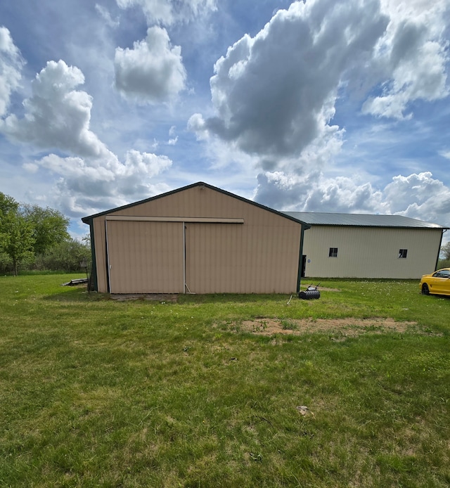 10071 Hillman Rd, Lakeview, MI 48850 - view of pole building featuring a yard