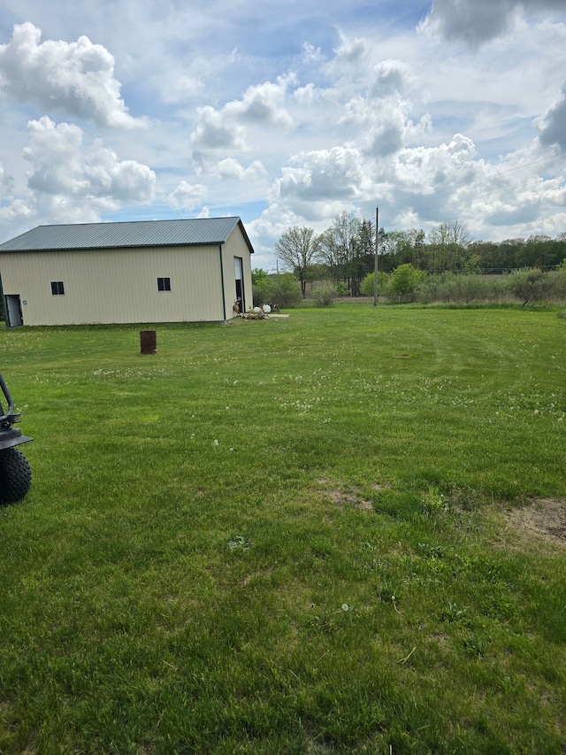 10071 Hillman Rd, Lakeview, MI 48850 - view of grassy yard with a pole building and an outbuilding