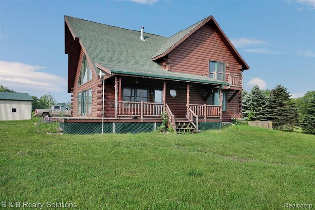10071 Hillman Rd, Lakeview, MI 48850 - back of property with log exterior, a yard, a porch, and roof with shingles