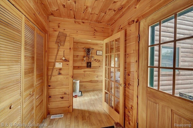 10071 Hillman Rd, Lakeview, MI 48850 - corridor with wooden walls, wood ceiling, hardwood / wood-style floors, and french doors