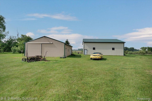 10071 Hillman Rd, Lakeview, MI 48850 - view of green lawn with an outbuilding