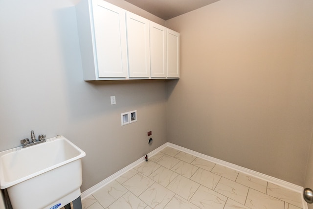 49681 Manistee Dr Unit 86, Chesterfield, MI 48047 - laundry area featuring light marble finish flooring, cabinet space, washer hookup, baseboards, and hookup for a gas dryer