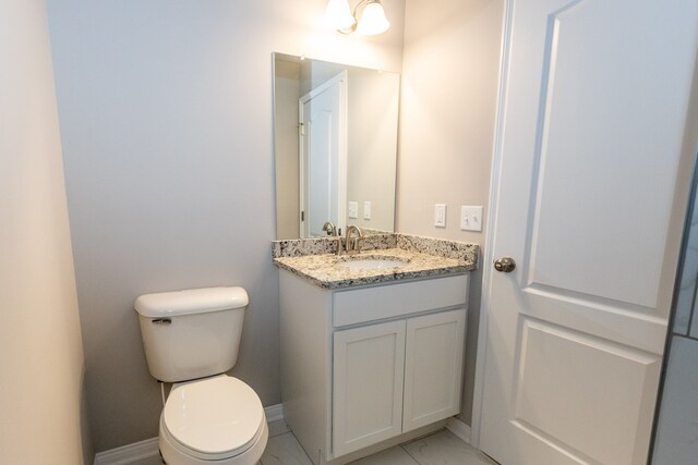 49681 Manistee Dr Unit 86, Chesterfield, MI 48047 - bathroom with toilet, vanity, and baseboards