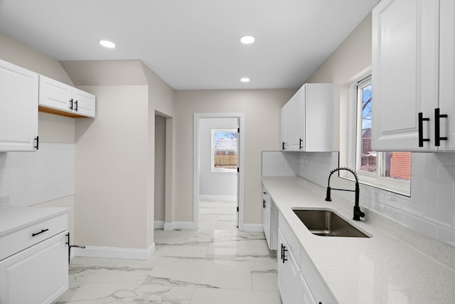 5027 Audubon Rd, Detroit, MI 48224 - kitchen featuring a sink, recessed lighting, baseboards, white cabinets, and tasteful backsplash