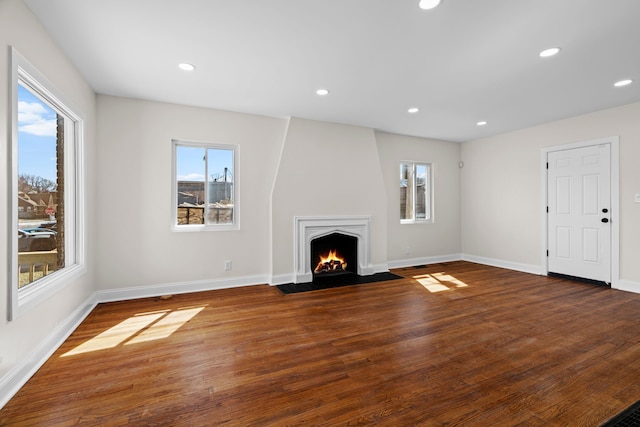 5027 Audubon Rd, Detroit, MI 48224 - unfurnished living room with a fireplace with flush hearth, wood finished floors, recessed lighting, and baseboards