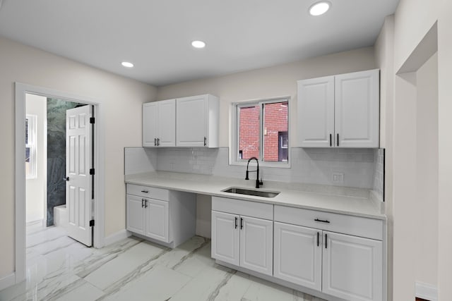 5027 Audubon Rd, Detroit, MI 48224 - kitchen with a sink, white cabinets, light countertops, decorative backsplash, and recessed lighting