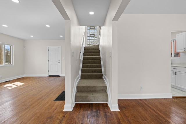 5027 Audubon Rd, Detroit, MI 48224 - stairs featuring baseboards, wood finished floors, and recessed lighting