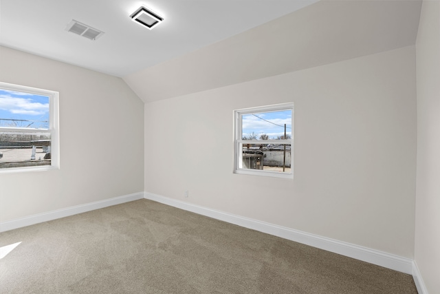 5027 Audubon Rd, Detroit, MI 48224 - bonus room featuring carpet, vaulted ceiling, baseboards, and healthy amount of natural light