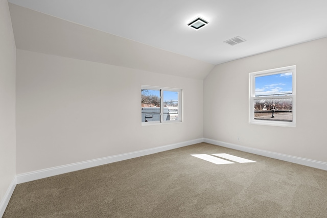 5027 Audubon Rd, Detroit, MI 48224 - carpeted spare room with baseboards and vaulted ceiling