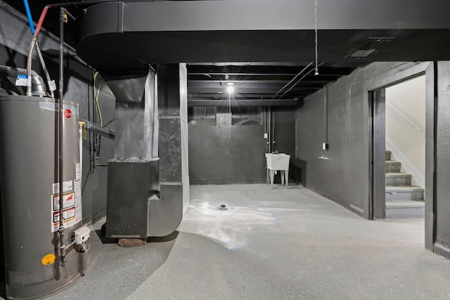 5027 Audubon Rd, Detroit, MI 48224 - unfinished below grade area with water heater, a sink, stairs, and heating unit