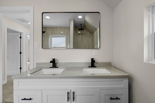 5027 Audubon Rd, Detroit, MI 48224 - full bathroom featuring a tile shower, double vanity, and recessed lighting