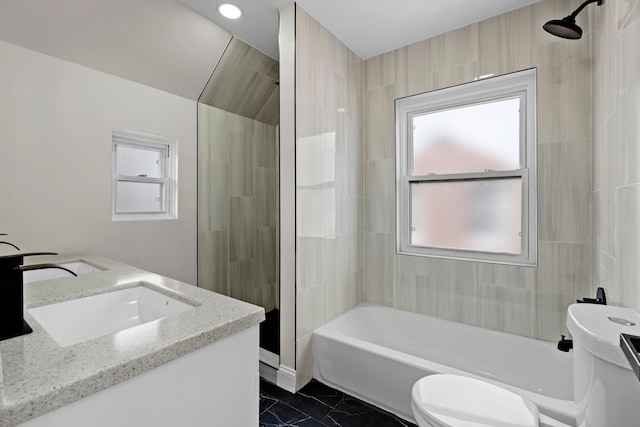 5027 Audubon Rd, Detroit, MI 48224 - bathroom with toilet, plenty of natural light, marble look tiles, and double vanity