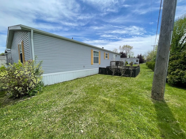 392 Hunters Rill, Oxford, MI 48371 - view of green lawn with a wooden deck
