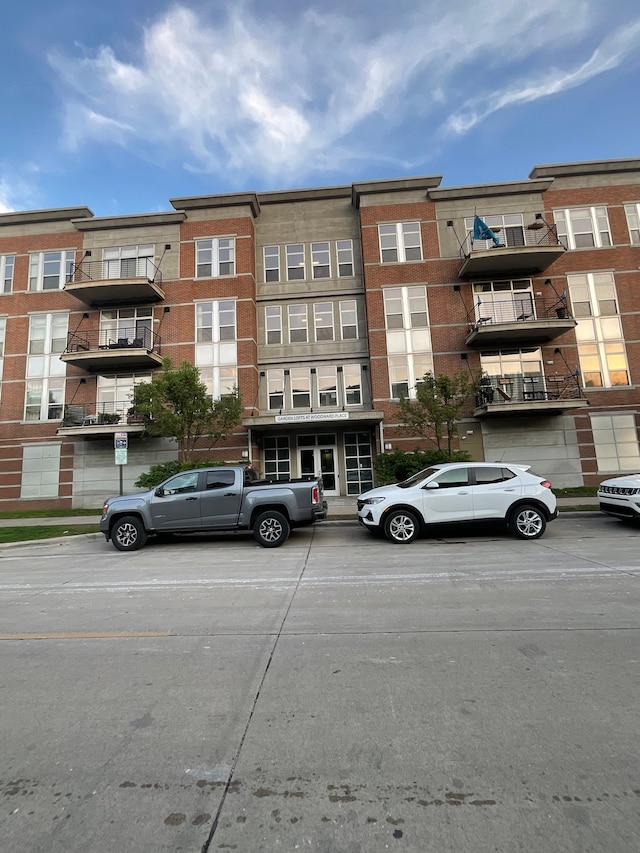 66 Winder St Unit 325, Detroit, MI 48201 - view of apartment building / complex featuring uncovered parking