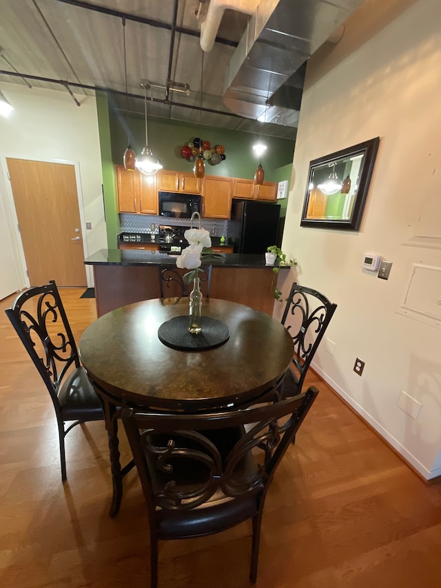 66 Winder St Unit 325, Detroit, MI 48201 - dining space with light wood finished floors and baseboards
