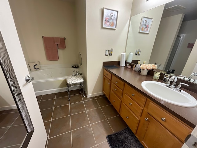 66 Winder St Unit 325, Detroit, MI 48201 - bathroom with tile patterned floors, vanity, a bath, baseboards, and a shower with door