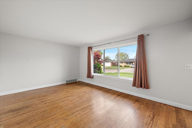 30657 Moulin Ave, Warren, MI 48088 - empty room with baseboards and wood finished floors