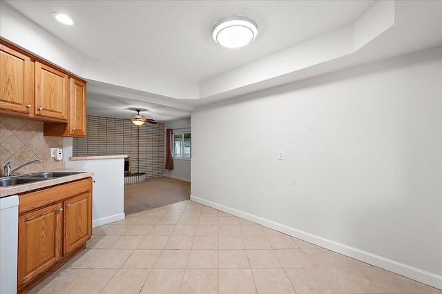 30657 Moulin Ave, Warren, MI 48088 - kitchen with baseboards, ceiling fan, a sink, brown cabinetry, and recessed lighting