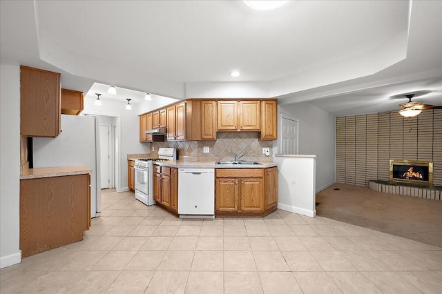 30657 Moulin Ave, Warren, MI 48088 - kitchen featuring white appliances, a sink, under cabinet range hood, light countertops, and a ceiling fan