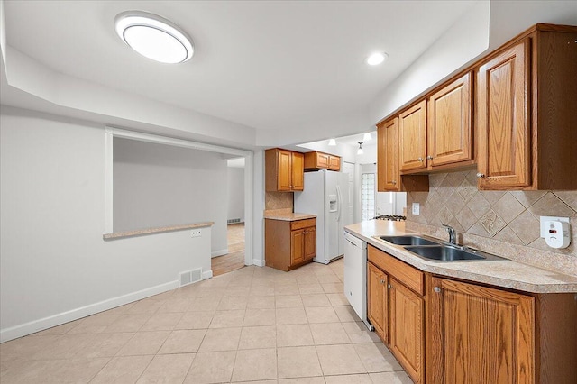 30657 Moulin Ave, Warren, MI 48088 - kitchen with white appliances, a sink, tasteful backsplash, light countertops, and recessed lighting