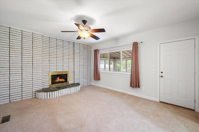 30657 Moulin Ave, Warren, MI 48088 - unfurnished living room with carpet flooring, a ceiling fan, a tiled fireplace, and baseboards