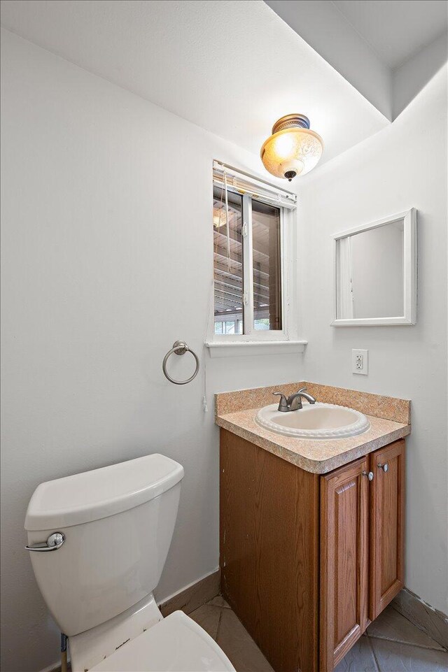30657 Moulin Ave, Warren, MI 48088 - half bath with toilet, vanity, tile patterned flooring, and baseboards