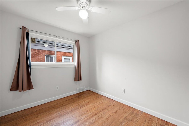 30657 Moulin Ave, Warren, MI 48088 - empty room with baseboards, wood finished floors, and a ceiling fan