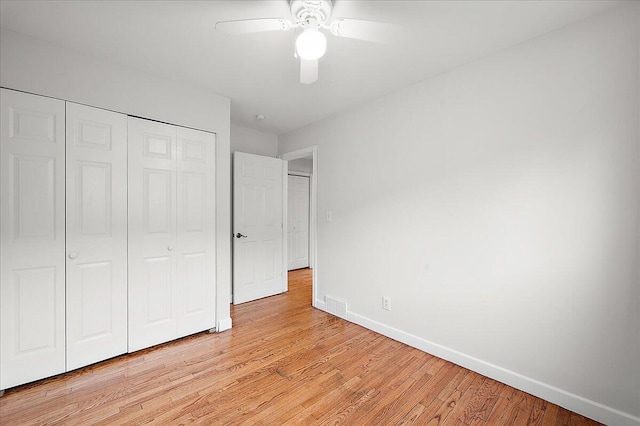 30657 Moulin Ave, Warren, MI 48088 - unfurnished bedroom with baseboards, a closet, light wood-type flooring, and a ceiling fan