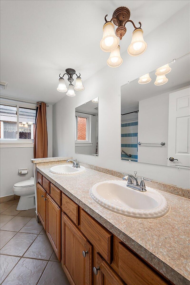 30657 Moulin Ave, Warren, MI 48088 - full bathroom featuring toilet, double vanity, a chandelier, and tile patterned floors