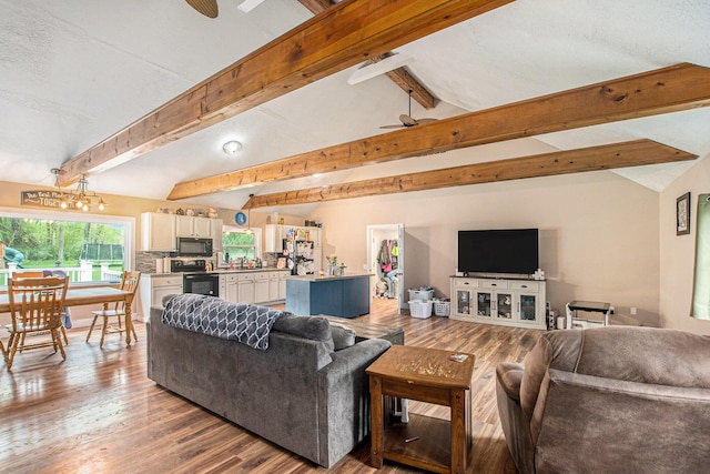 557 W James St, Lawrence, MI 49064 - living room featuring a ceiling fan and light wood-style flooring