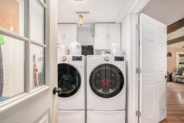 557 W James St, Lawrence, MI 49064 - washroom with cabinet space, separate washer and dryer, and wood finished floors