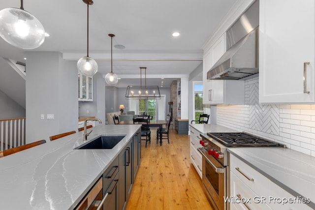 631 Greenslate Dr SE, Ada, MI 49301 - kitchen featuring high end stainless steel range, a sink, white cabinetry, backsplash, and recessed lighting