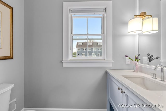 631 Greenslate Dr SE, Ada, MI 49301 - half bath with vanity and toilet