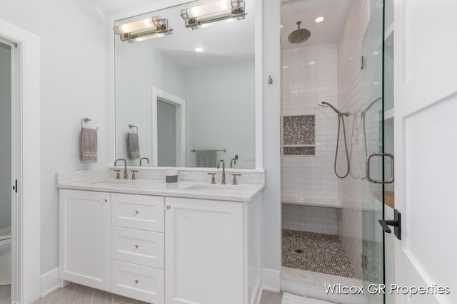 631 Greenslate Dr SE, Ada, MI 49301 - full bathroom with a stall shower, double vanity, and recessed lighting