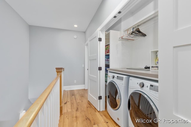631 Greenslate Dr SE, Ada, MI 49301 - clothes washing area with washer and dryer, recessed lighting, light wood-type flooring, and baseboards