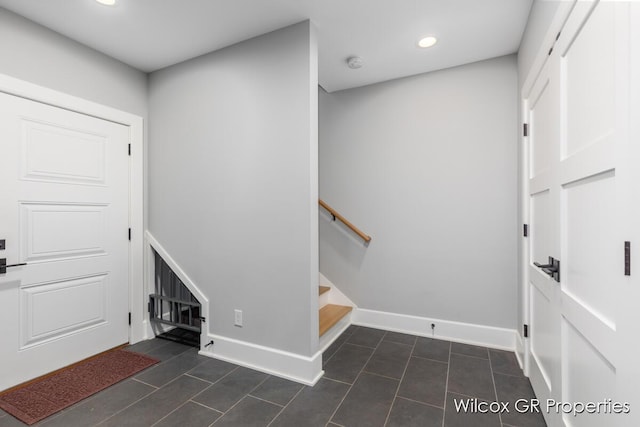 631 Greenslate Dr SE, Ada, MI 49301 - foyer with recessed lighting, dark tile patterned flooring, and baseboards