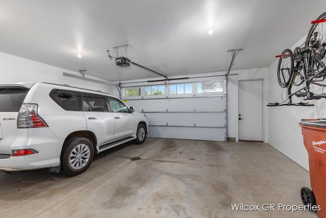 631 Greenslate Dr SE, Ada, MI 49301 - garage with a garage door opener