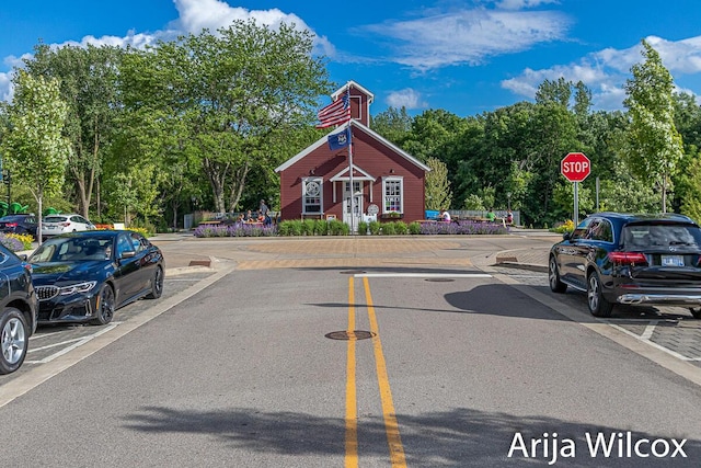 631 Greenslate Dr SE, Ada, MI 49301 - view of asphalt street with traffic signs