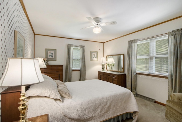 bedroom with carpet flooring, baseboards, ornamental molding, and ceiling fan