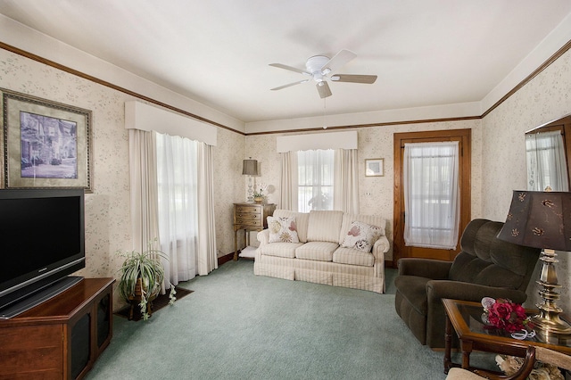 living area with wallpapered walls, carpet floors, and ceiling fan